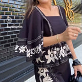 CONJUNTO DE PANTALÓN NEGRO CON FLORES BEIGE