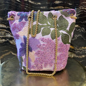 LIMOSNERA ESTAMPADA CON LENTEJUELAS TONOS MALVA