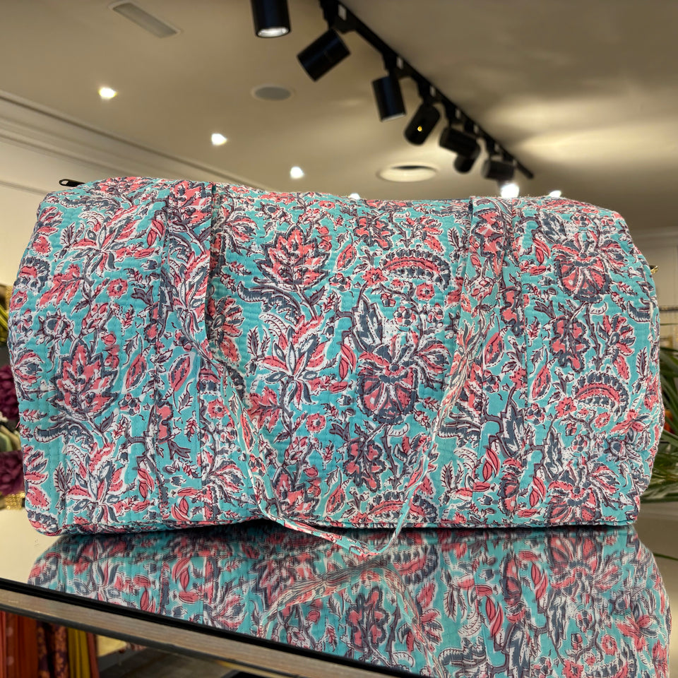 BOLSA ESTAMPADA FONDO TURQUESA