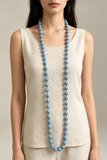 COLLAR BOLAS TELA CELESTE