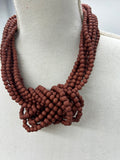 COLLAR NUDO TEJA