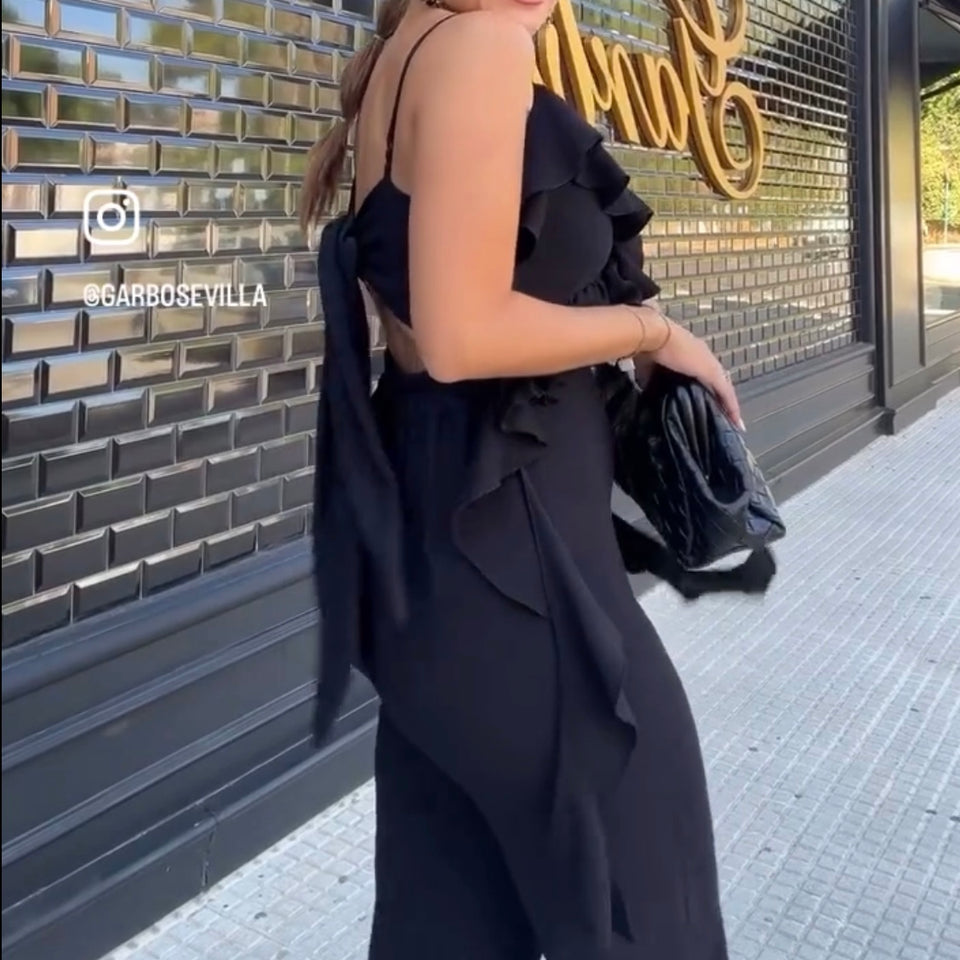 MONO CON VOLANTES ATADO A LA ESPALDA NEGRO