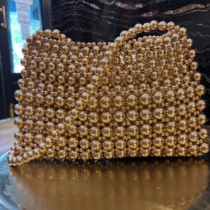 BOLSO DE FIESTA DE BOLAS DORADO