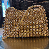 BOLSO DE FIESTA DE BOLAS DORADO