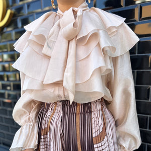 BLUSA DE VOLANTES ROSA NUDE