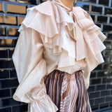 BLUSA DE VOLANTES ROSA NUDE
