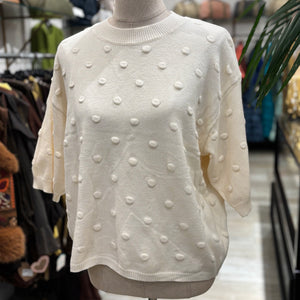 JERSEY CON TOPO EN RELIEVE BEIGE