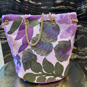 LIMOSNERA ESTAMPADA CON LENTEJUELAS TONOS MALVA